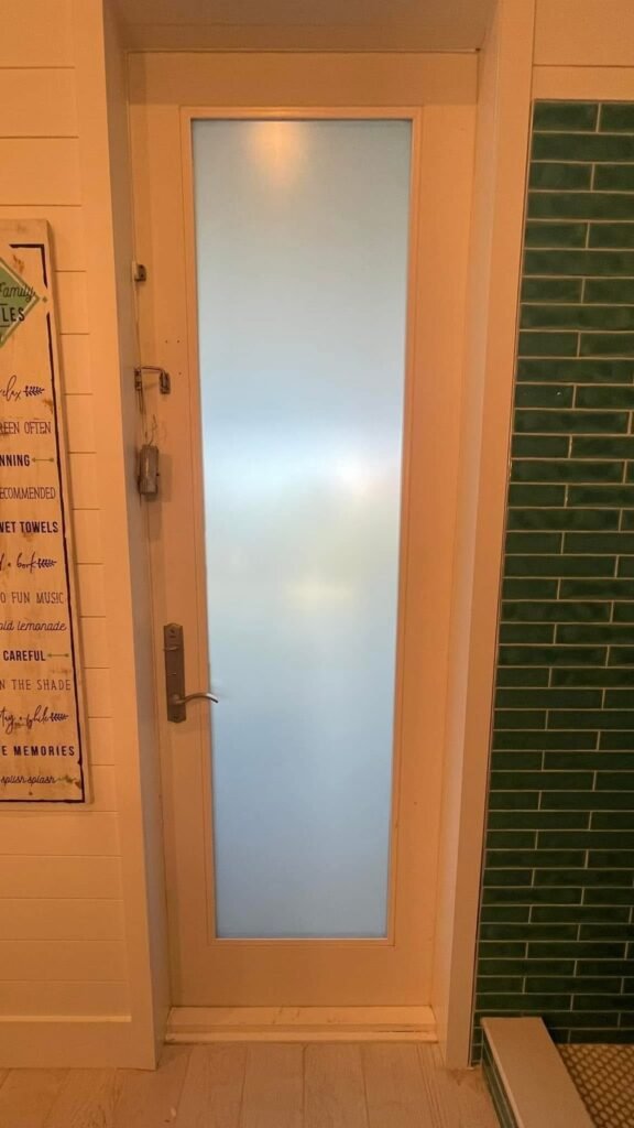 Frosted privacy window film on a glass entry door installed by K&H Window Tinting